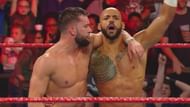 Finn Bálor and Ricochet celebrating after their win